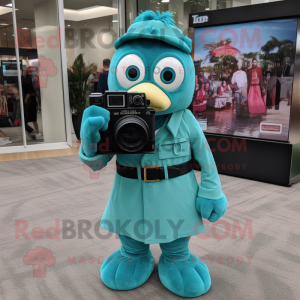 Teal Camera mascot costume character dressed with a Dress Pants and Headbands