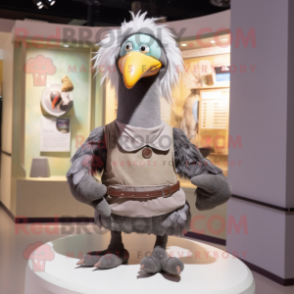 Gray Dodo Bird mascot costume character dressed with a Tank Top and Belts