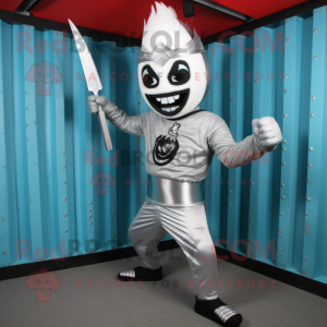Silver Knife Thrower mascot costume character dressed with a Rash Guard and Cummerbunds