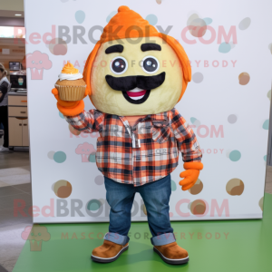 Orange Cupcake mascot costume character dressed with a Flannel Shirt and Keychains