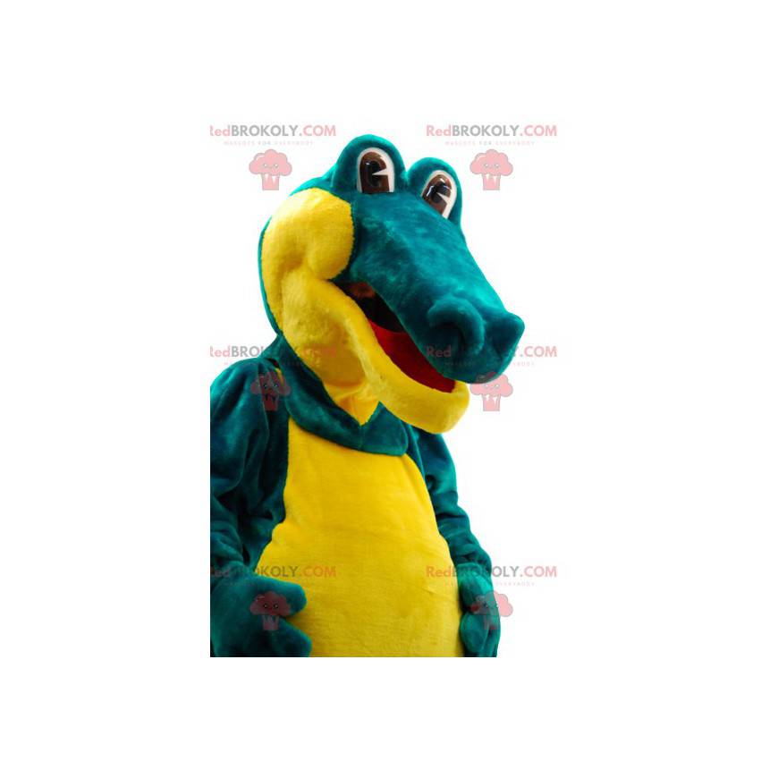 Bardzo komiczna zielono-żółta maskotka krokodyla. -