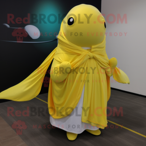 Lemon Yellow Humpback Whale mascot costume character dressed with a Jumpsuit and Shawls