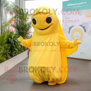 Lemon Yellow Humpback Whale mascot costume character dressed with a Jumpsuit and Shawls