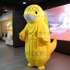 Lemon Yellow Humpback Whale mascot costume character dressed with a Jumpsuit and Shawls