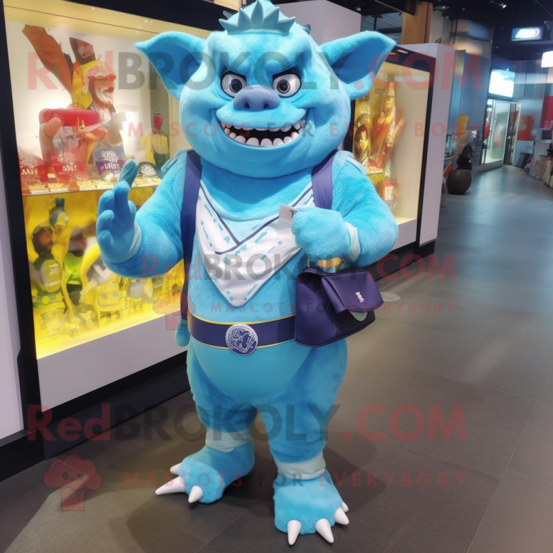 Sky Blue Ogre mascot costume character dressed with a Rash Guard and Wallets Sky Blue Ogre mascot costume character dressed with a Rash Guard and Wallets