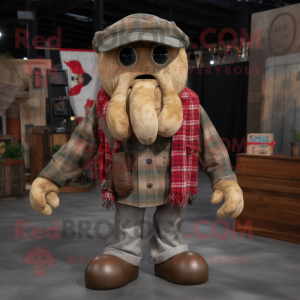 Tan Kraken mascot costume character dressed with a Flannel Shirt and Brooches