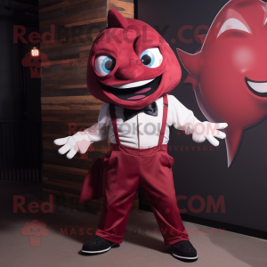 Maroon Tuna mascot costume character dressed with a Jumpsuit and Bow ties