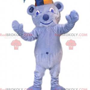 Mascota oso azul claro con sombrero de bromista. -