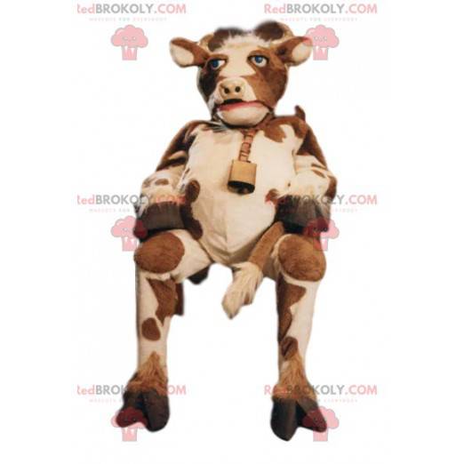 Mascota de la vaca marrón y blanca con una campana -