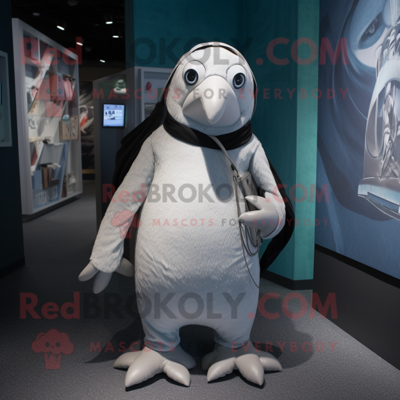 Silver Penguin mascot costume character dressed with a Trousers and Anklets