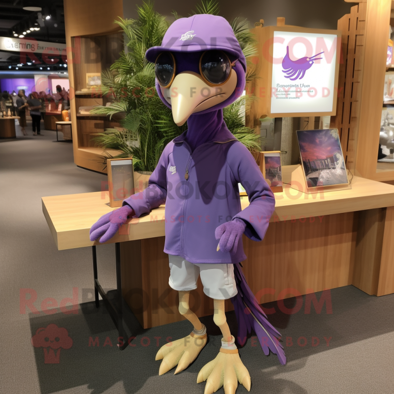 Purple Archeopteryx mascot costume character dressed with a Long Sleeve Tee and Caps