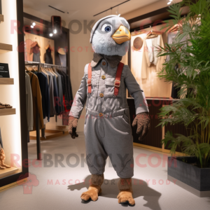 Gray Pheasant mascot costume character dressed with a Dungarees and Keychains