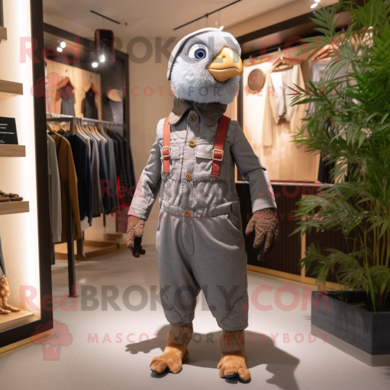 Gray Pheasant mascot costume character dressed with a Dungarees and Keychains Gray Pheasant mascot costume character dressed with a Dungarees and Keychains