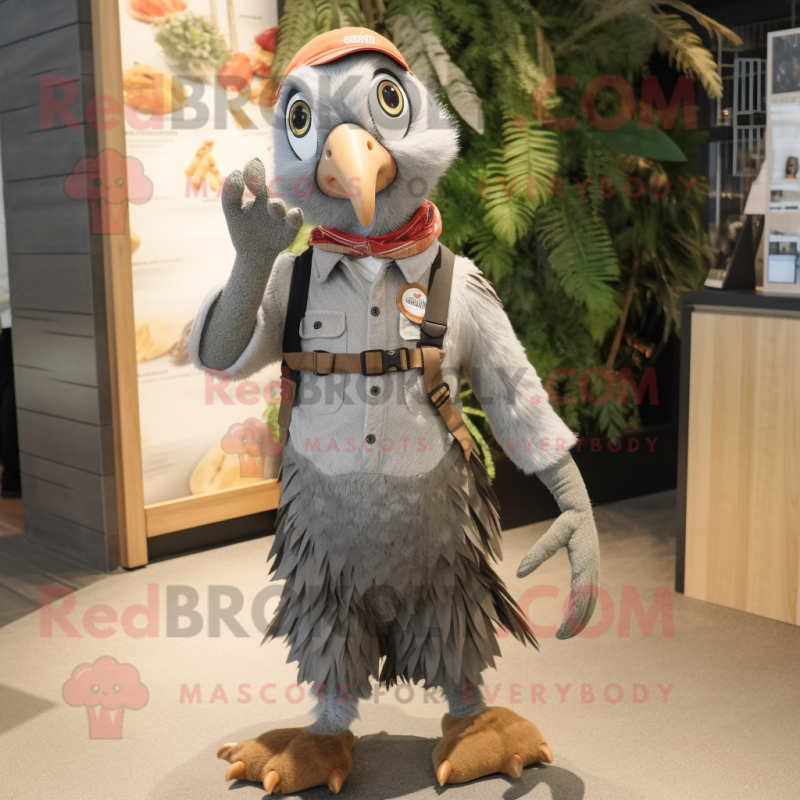 Gray Pheasant mascot costume character dressed with a Dungarees and Keychains Gray Pheasant mascot costume character dressed with a Dungarees and Keychains