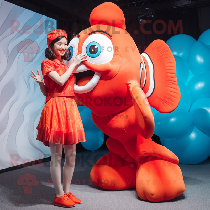 Red Clown Fish mascot costume character dressed with a A-Line Dress and Rings Red Clown Fish mascot costume character dressed with a A-Line Dress and Rings