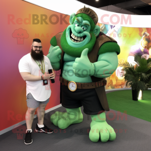 Green Strongman mascot costume character dressed with a Maxi Dress and Smartwatches