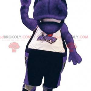 Maskotka fioletowy hipopotam w odzieży sportowej. -
