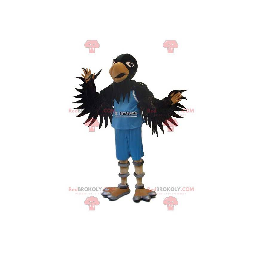 Schwarzes Adler-Maskottchen im blauen Unterstützer-Outfit -