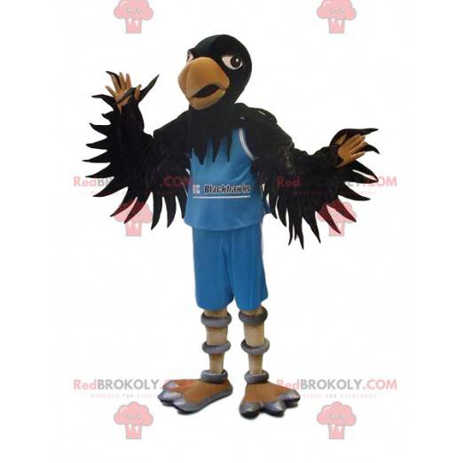 Mascotte d'aigle noir en tenue de supporter bleue -