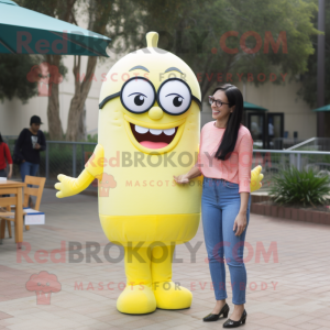 Lemon Yellow Rainbow mascot costume character dressed with a Mom Jeans and Reading glasses