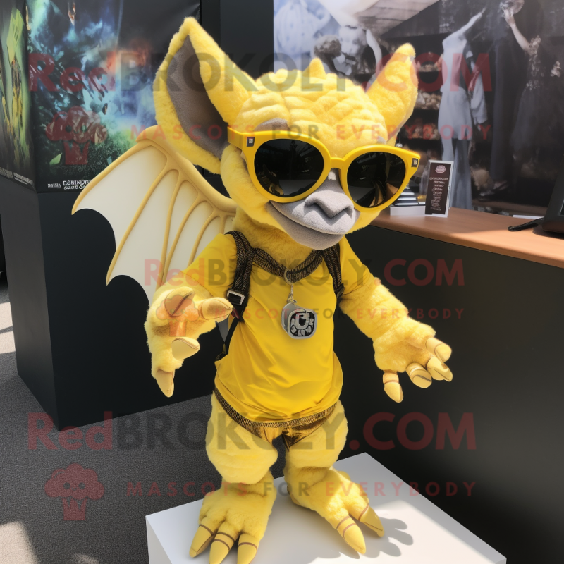 Yellow Gargoyle mascot costume character dressed with a Romper and Sunglasses