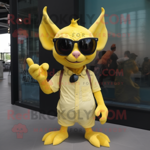 Yellow Gargoyle mascot costume character dressed with a Romper and Sunglasses