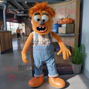 Orange Frankenstein'S Monster mascot costume character dressed with a Chambray Shirt and Keychains