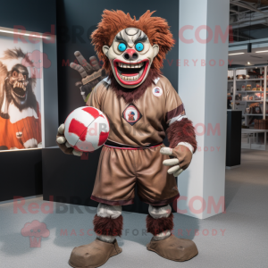 Brown Evil Clown mascot costume character dressed with a Rugby Shirt and Keychains