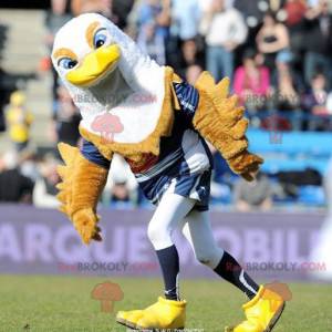 Mascota de pájaro águila marrón blanca y amarilla -