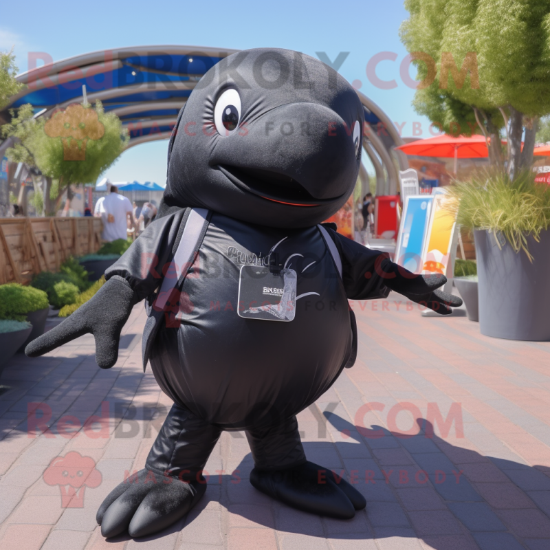 Black Humpback Whale mascot costume character dressed with a Playsuit and Messenger bags