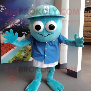 Cyan Crab Cakes mascot costume character dressed with a Graphic Tee and Hat pins