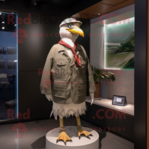 Olive Gull mascot costume character dressed with a Jacket and Ties