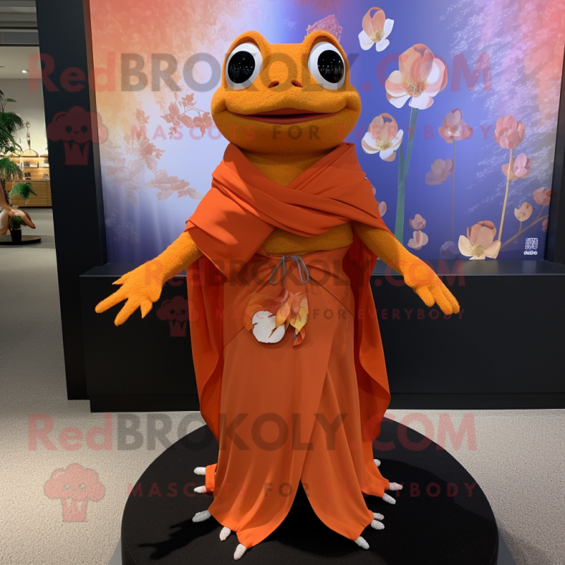 Orange Frog mascot costume character dressed with a Wrap Dress and Shawl pins