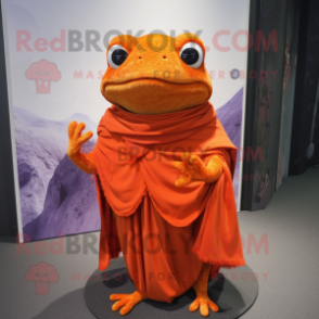 Orange Frog mascot costume character dressed with a Wrap Dress and Shawl pins