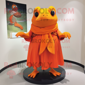 Orange Frog mascot costume character dressed with a Wrap Dress and Shawl pins