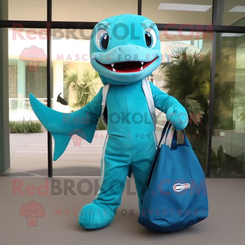 Turquoise Barracuda mascot costume character dressed with a Jumpsuit and Tote bags