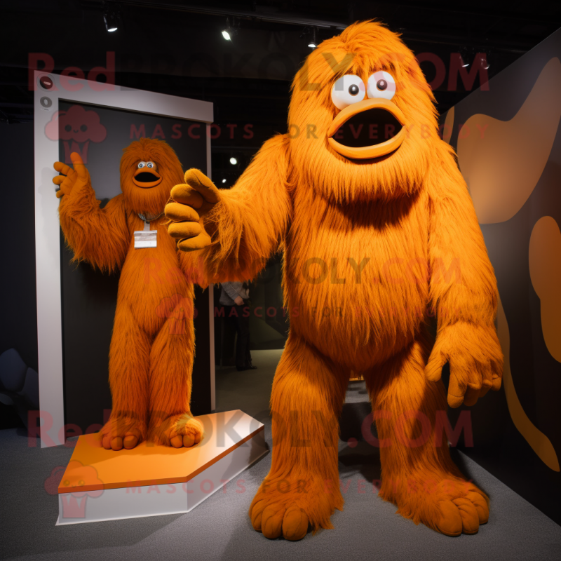 Orange Sasquatch mascot costume character dressed with a Playsuit and Ties Orange Sasquatch mascot costume character dressed with a Playsuit and Ties