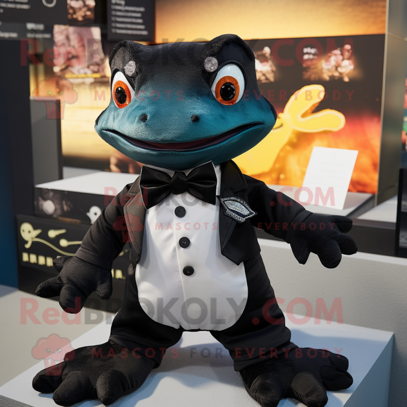 Black Geckos mascot costume character dressed with a T-Shirt and Bow ties Black Geckos mascot costume character dressed with a T-Shirt and Bow ties