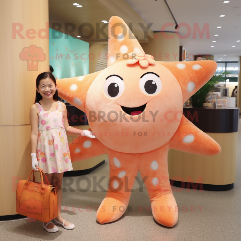 Peach Starfish mascot costume character dressed with a Shift Dress and Wallets