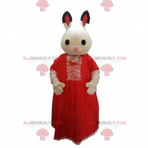 Kaninchenmaskottchen mit einem roten Spitzenkleid. -