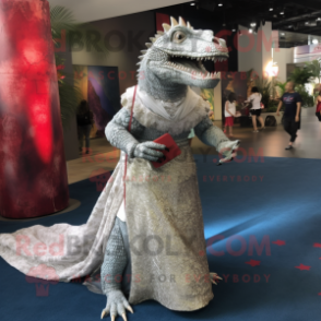 Silver Komodo Dragon mascot costume character dressed with a Ball Gown and Messenger bags