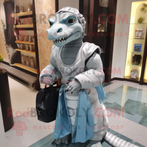 Silver Komodo Dragon mascot costume character dressed with a Ball Gown and Messenger bags