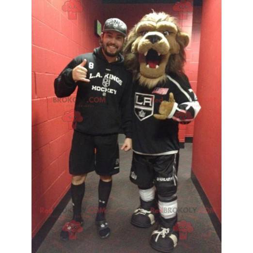 Mascotte de lion marron avec une grande crinière poilue -