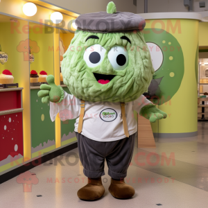 Olive Cupcake mascot costume character dressed with a Henley Tee and Tie pins