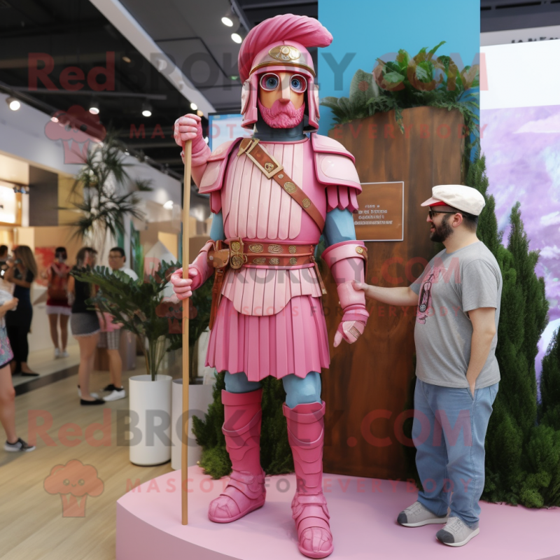 Pink Roman Soldier mascot costume character dressed with a Chambray Shirt and Rings Pink Roman Soldier mascot costume character dressed with a Chambray Shirt and Rings