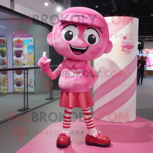 Pink Candy mascot costume character dressed with a Shorts and Headbands
