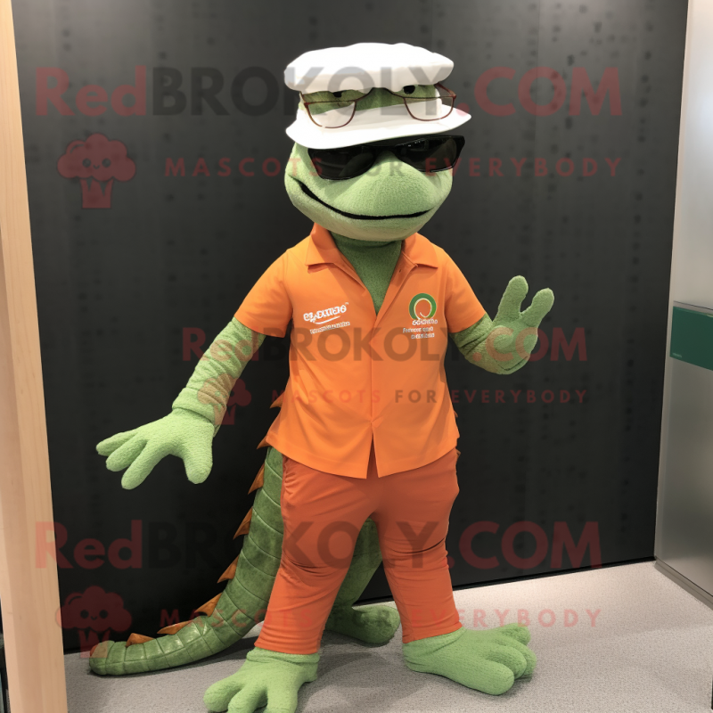 Peach Crocodile mascot costume character dressed with a Graphic Tee and Eyeglasses Peach Crocodile mascot costume character dressed with a Graphic Tee and Eyeglasses