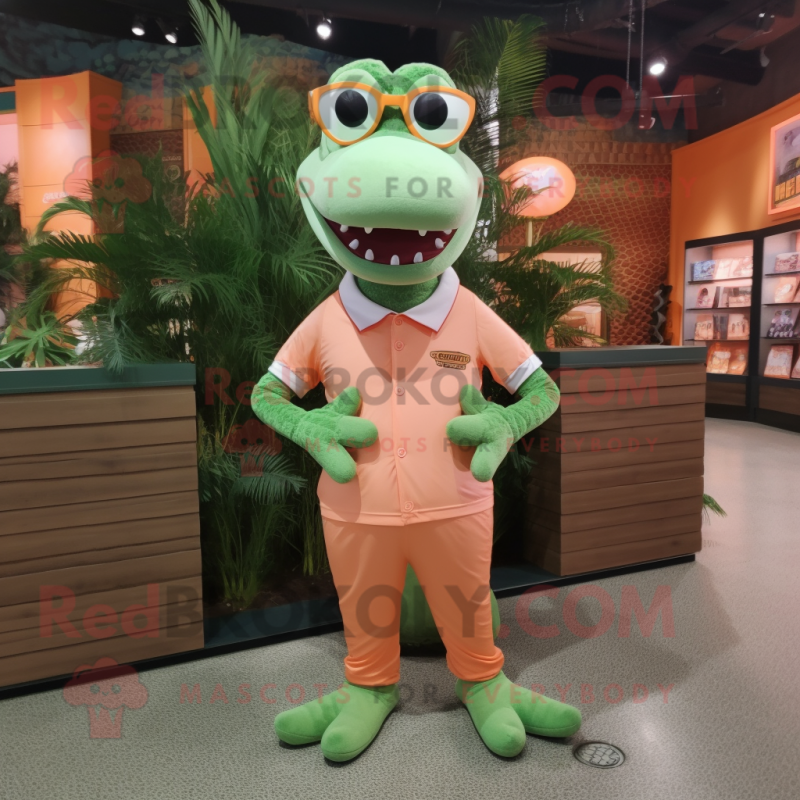 Peach Crocodile mascot costume character dressed with a Graphic Tee and Eyeglasses