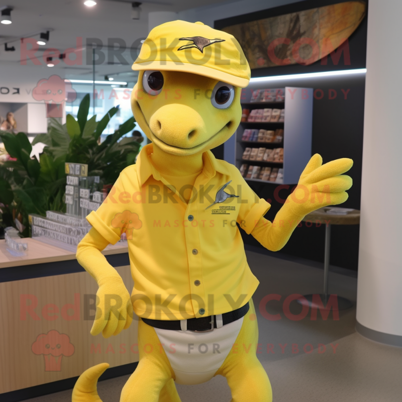 Yellow Dimorphodon mascot costume character dressed with a Polo Shirt and Brooches Yellow Dimorphodon mascot costume character dressed with a Polo Shirt and Brooches