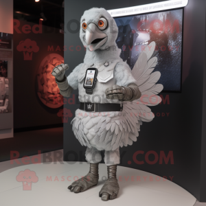 Silver Turkey mascot costume character dressed with a Bodysuit and Smartwatches